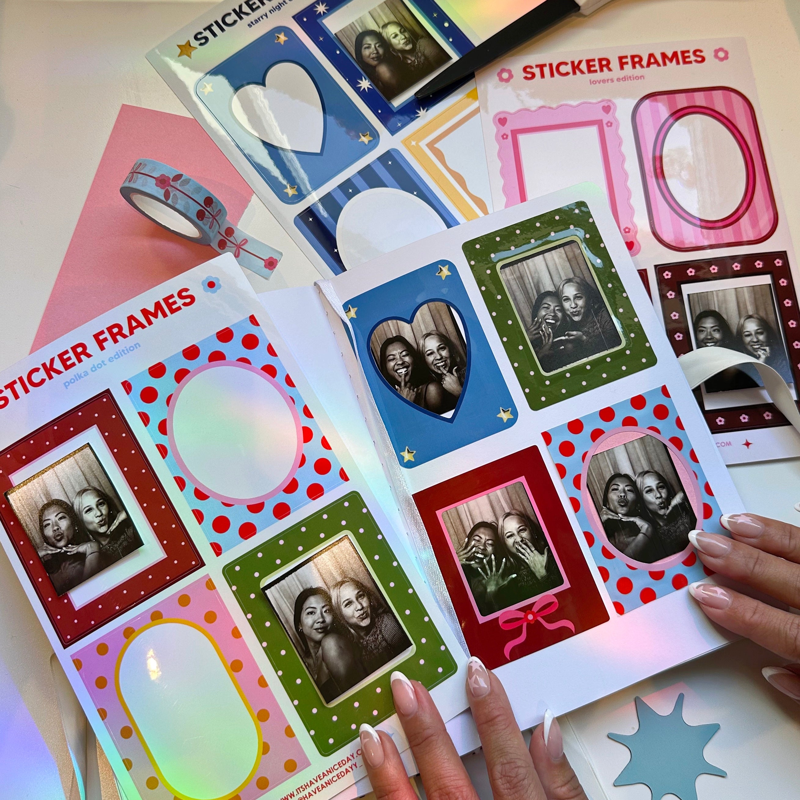 Sticker frames with photos and decorative elements on a table.
