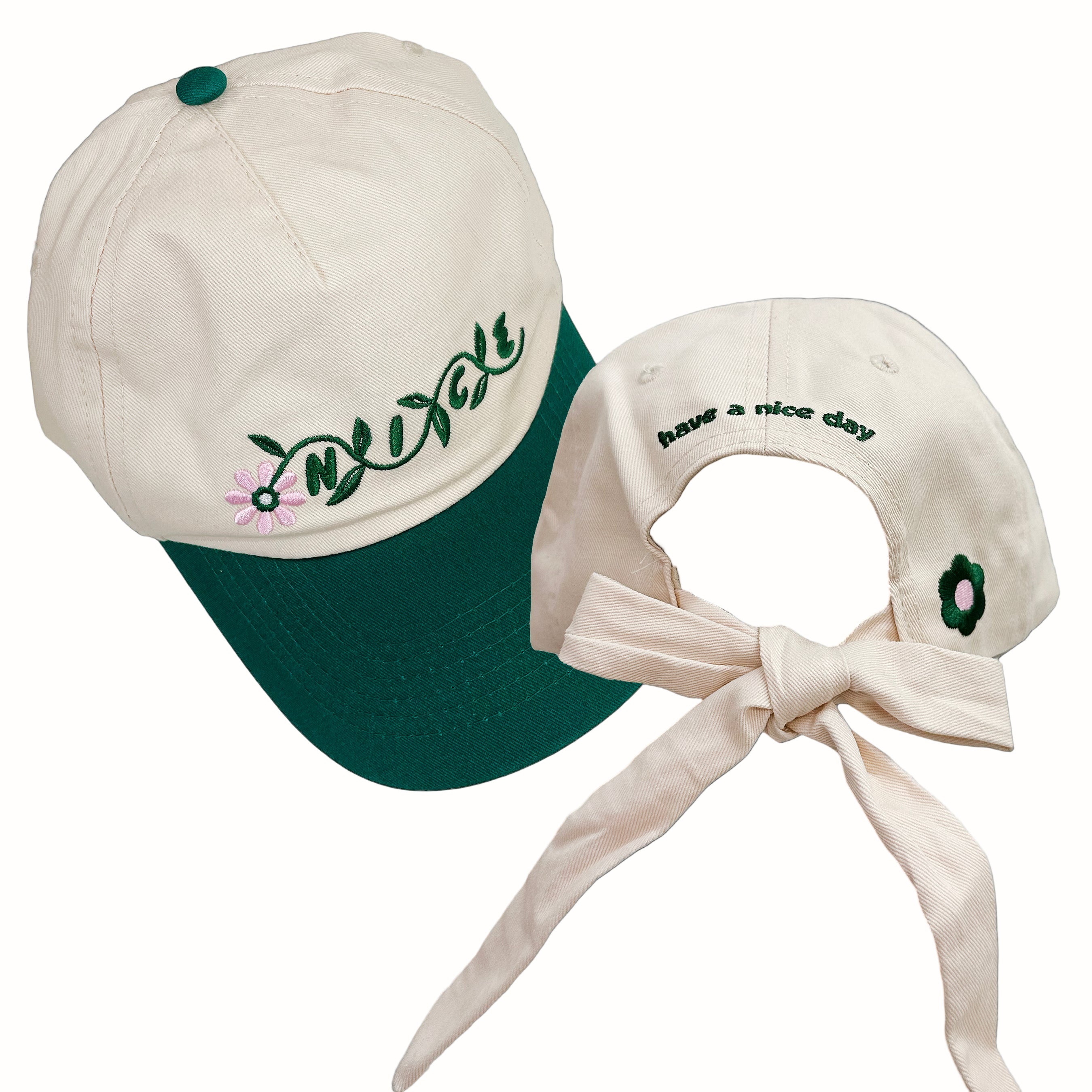 Two white baseball caps with decorative elements on a black background