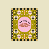 A colorful print with floral patterns and the text 'HOW LUCKY AM I? TO CREATE THINGS IN MY MIND AND BRING THEM TO LIFE WITH MY HANDS' in the center.